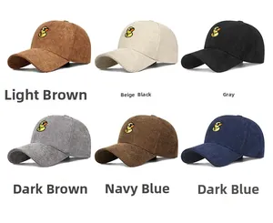 Detail of embroidered duck on corduroy baseball caps in six diverse trendy colors