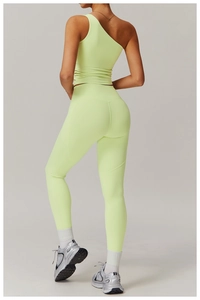 Detail view of high-waist sculpting leggings with U-shaped back seam in neon green