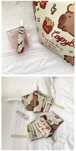 Detail of Capybara cartoon folding umbrella with beige fabric and cute animal patterns