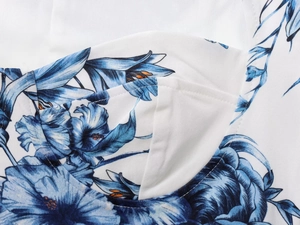 Close-up of floral print crop top showing detailed stitching and summer pattern