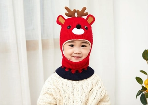 Detailed knit texture of red deer-themed baby hood with ear flaps and navy neck warmer