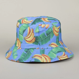Detailed close-up of blue sun hat featuring vibrant yellow banana and green leaf prints