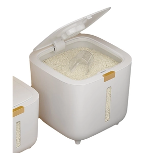 Airtight white rice storage container with gold button and measuring cup for kitchen