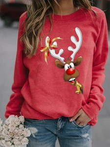 Detail of red Christmas reindeer print on long sleeve soft knit sweatshirt for women