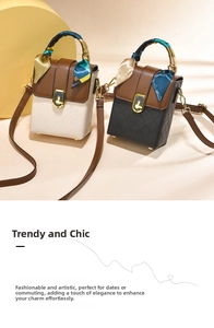 Détail du petit sac carré bicolore avec texture matelassée et poignée en foulard de soie
