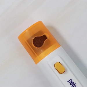 Electric pet nail grinder with orange safety guard and protective cover for cats and dogs