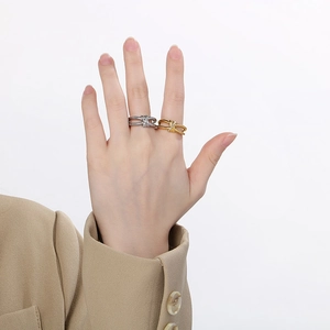 Minimalist stainless steel knot rings with rhinestones in gold and silver finish