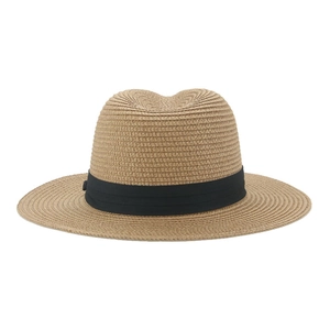 Close-up of the fine straw weave texture and black grosgrain ribbon on the sun hat
