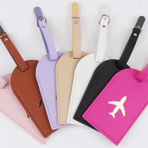 Waterproof leather luggage tags in multiple colors with golden airplane pattern