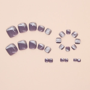 Detail of shimmering mauve toe press-on nails with silver glitter French tips
