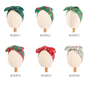 Christmas baby bow headwrap set featuring candy cane and reindeer prints on red and green