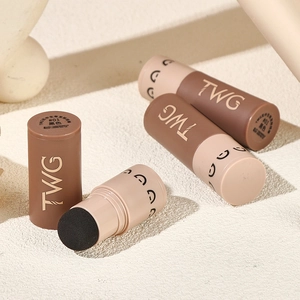 Macro detail of four TWG hairline contouring sticks in shade #01 black with beige caps