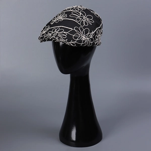 Fashionable black flat cap with large white flower embroidery for outdoor travel and photos