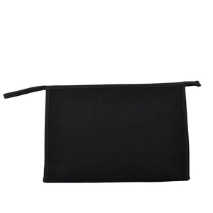 Détail d'une pochette professionnelle noire en toile avec fermeture éclair et texture