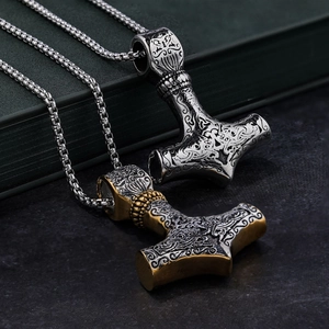 Close-up of Mjölnir pendant showing intricate Celtic knot patterns and silver finish