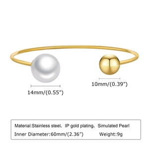 Detail view of 60mm open cuff bangle with 14mm simulated pearl and 10mm gold ball
