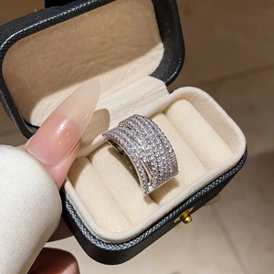 Luxurious silver ring with multi-row zircon pavé shown in a jewelry display box