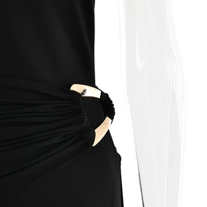 Close-up of elegant black one-shoulder dress showing metal ring buckle and waist pleats