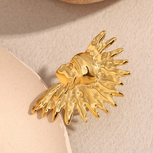 Macro shot of the 18K gold plated ring featuring a sunburst lion head with hammered texture