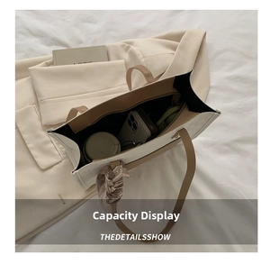 Top view of spacious interior of cream tote bag showing capacity for daily essentials