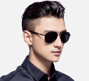 Close-up of polarized pilot sunglasses for men with black lenses and metallic frame