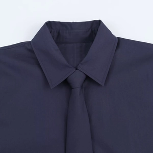 Fashionable dark blue poplin shirt with matching tie and detailed collar craftsmanship
