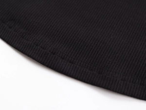 Macro shot of durable hem stitching on black ribbed high-elastic sports tank top
