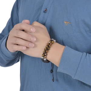 Detail of 8mm double-layer tiger eye and lava stone beaded bracelet on male wrist