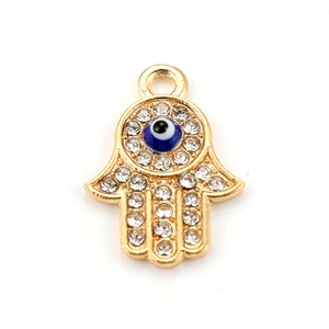 Hamsa Hand pendant with blue Evil Eye and sparkling rhinestones on white background