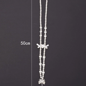 50cm pearl phone lanyard with silver bows and shell elements on grey background