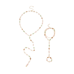 Elegant gold body chain set with colorful resin stones and tassel details on white