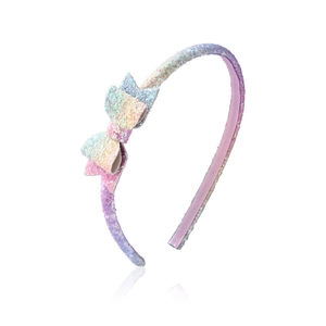 Glittery gradient bow headband for girls featuring pastel macaron colors on a white base
