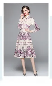 Detail of shirt collar and button-down front on beige long sleeve floral dress