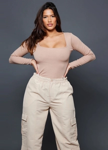 Detail view of women's beige Y2K ribbed long sleeve top and cargo pants on studio model