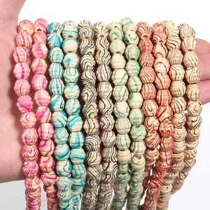Detail showing colorful ribbed wooden beads with marble texture for DIY jewelry crafts
