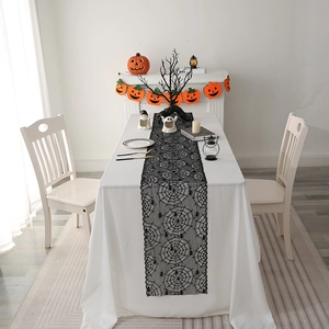 Halloween black lace table runner featuring spider web and spider patterns for holiday decor