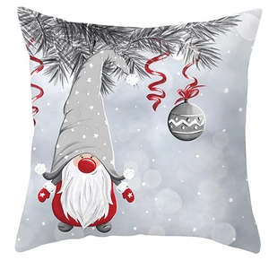 Detail of Christmas pillowcase featuring a cute gnome with stars and festive pine branches