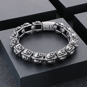 Detail of vintage skull bracelet showing engraved stainless steel clasp and gothic links