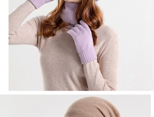 Close-up detail of knitted winter set including scarf, touch-screen gloves and beanie