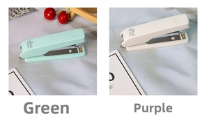Detail view of portable mini staplers in mint green and soft purple with built-in remover