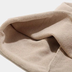 Fashionable beige knit beanie hat for women featuring warm French Terry texture