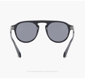 Close-up of stylish double bridge design and metal hinges on black frame sunglasses