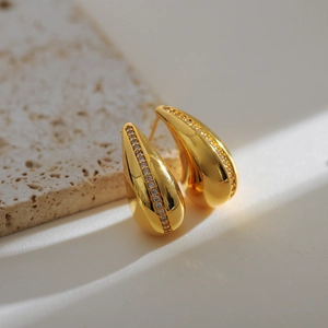 Golden teardrop stainless steel earrings with a row of clear sparkling zircon stones