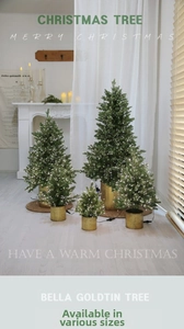 Detail of five mini LED Christmas trees with golden tin bases for holiday home decor