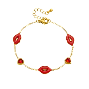 Gold chain bracelet with red enamel lips and crystal heart charms on white background