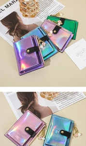Detailed macro view of laser-textured wallets in multiple colors with floral pendants