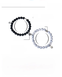 Detail view of 8mm pink zebra stone beads and magnetic heart clasp on couple bracelets