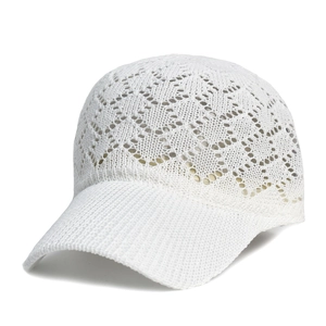 Close-up of white hollow knit baseball cap showing crochet pattern and textured visor