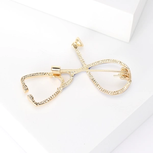 Creative stethoscope brooch for doctors and nurses with gold finish and rhinestones