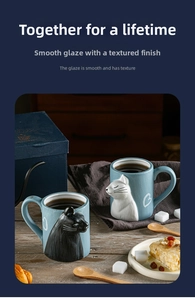 Detail showing high-quality ceramic couple mugs with 3D cat relief and heart patterns